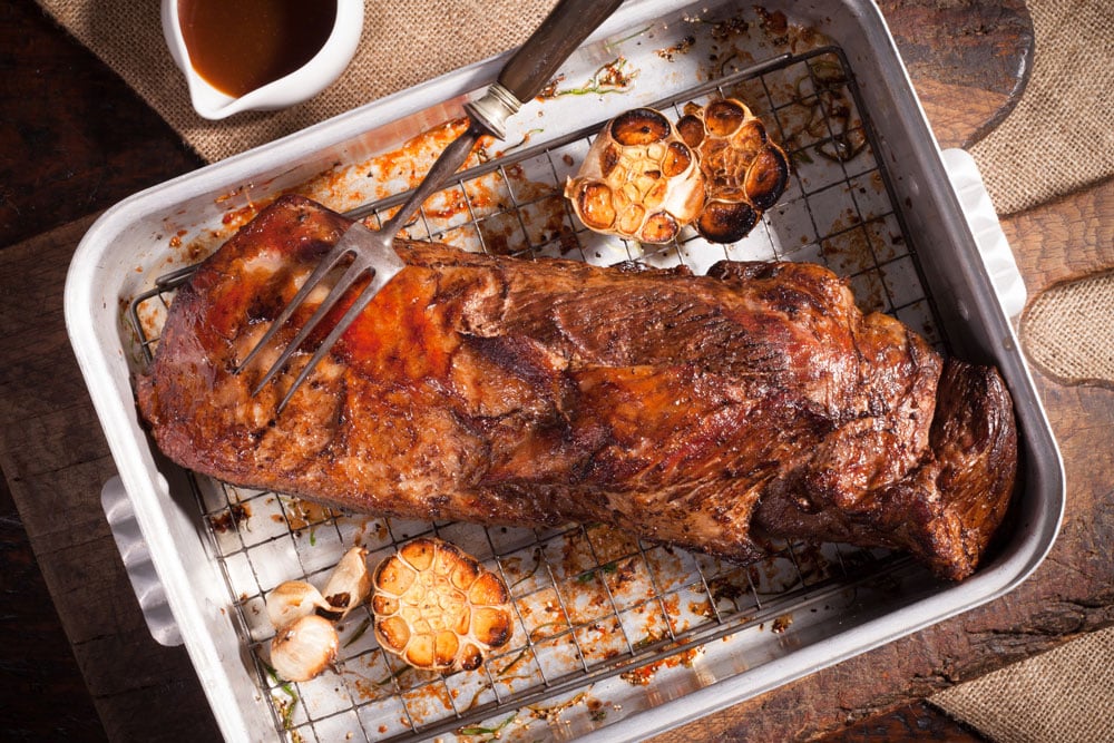 Cooked beef brisket in rounded square dish